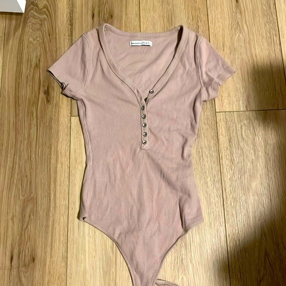 button up blush body suit